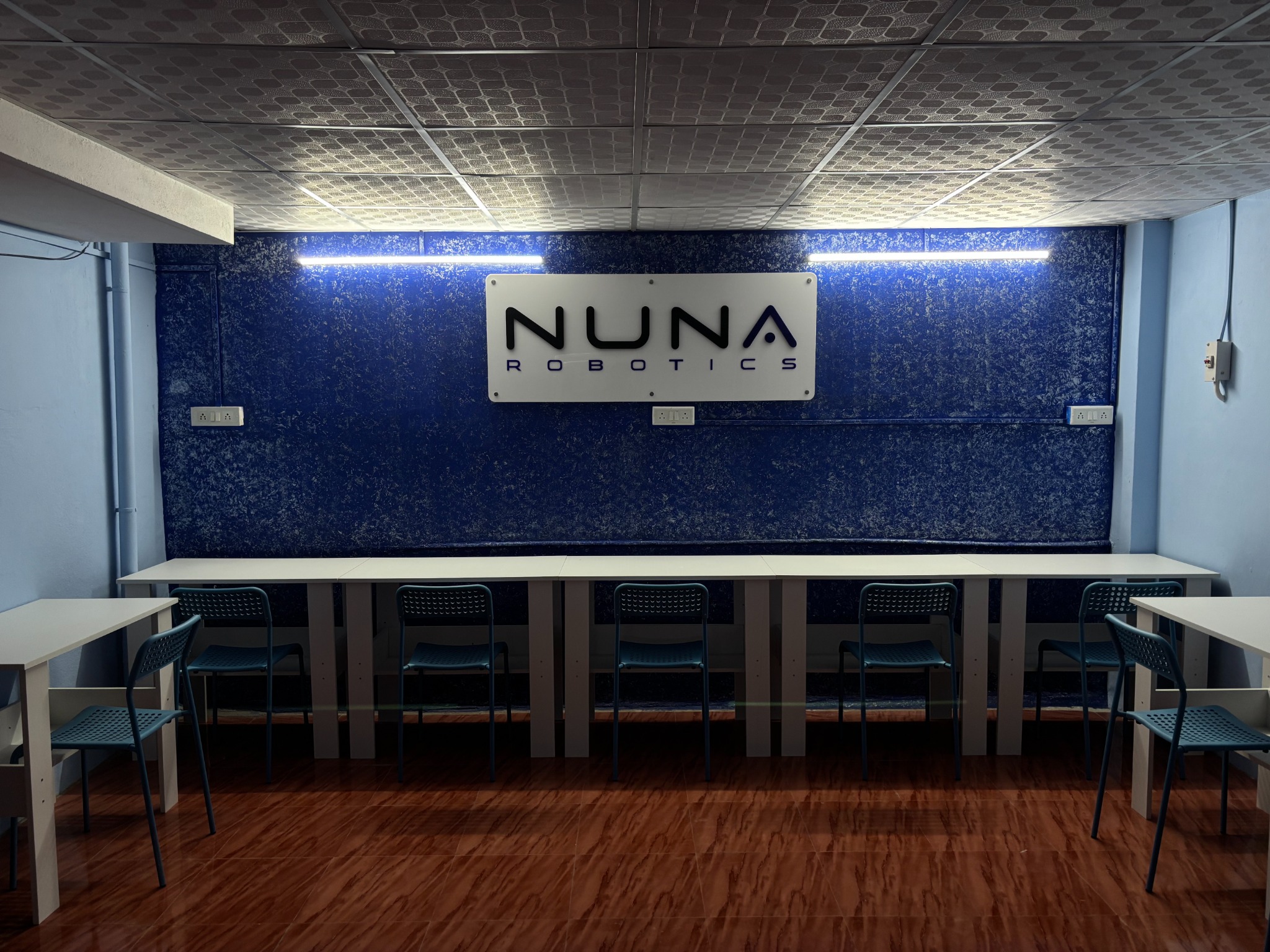 NuNa Robotics classroom with NuNa sign and workbenches